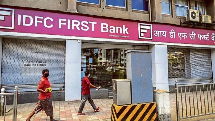 IDFC First Bank share price jumps 9% on strong Q1 results 2026. Should you buy or sell?